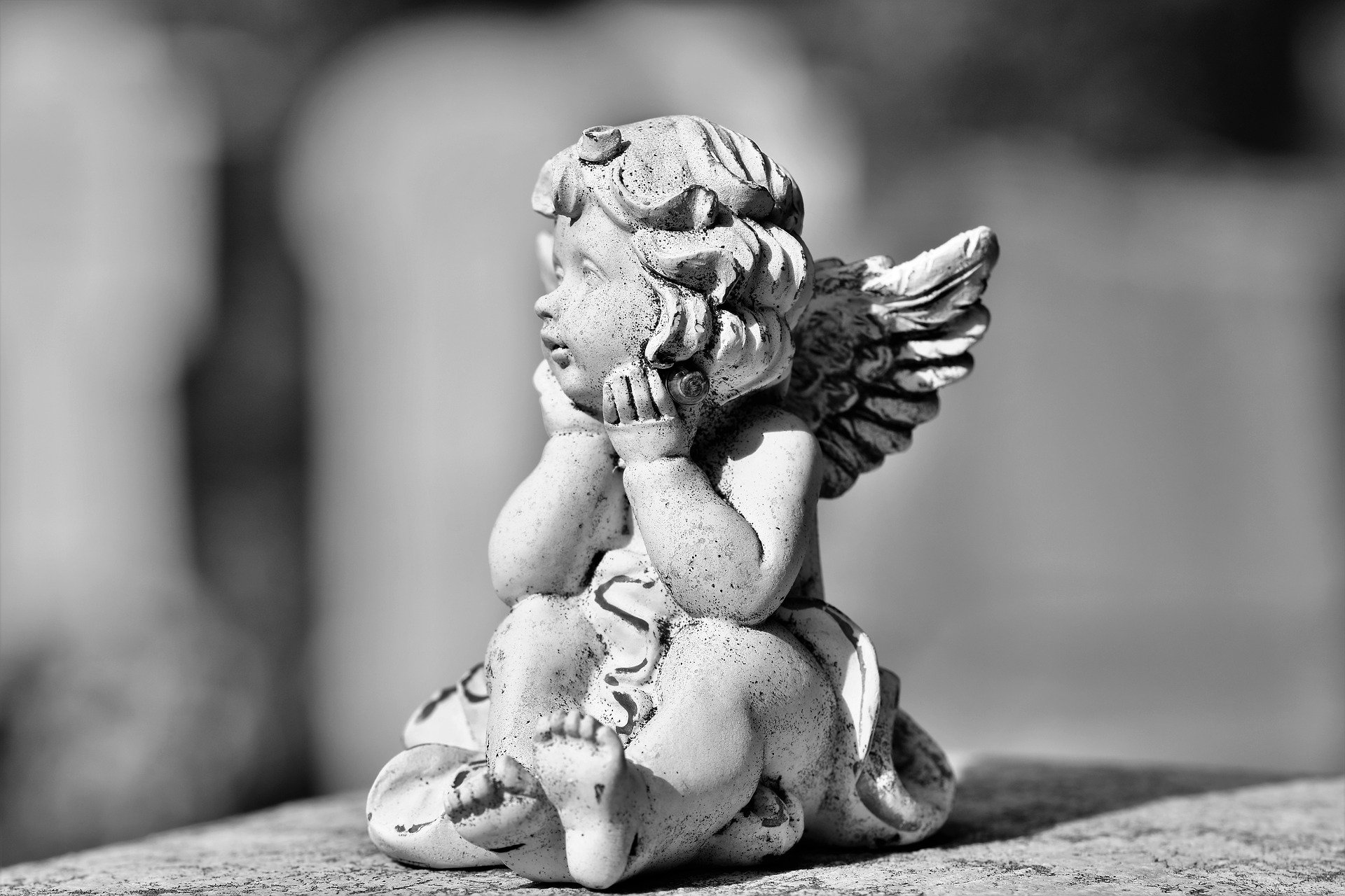 A Little Angel Sculpture Looking The Landscape
