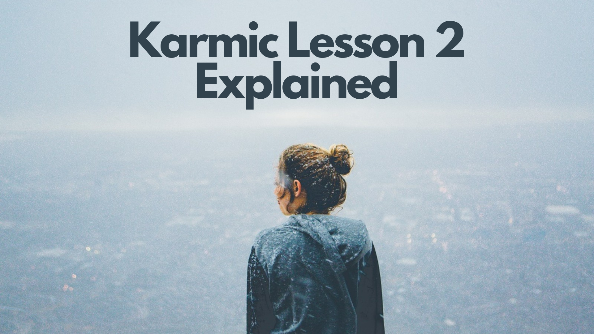 A woman standing and looking the city from above with words Karmic Lesson 2 Explained