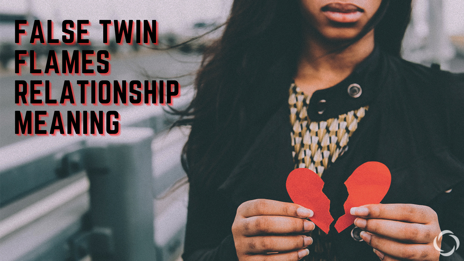 A woman holding a broken heart shaped paper with words False Twin Flames Relationship Meaning
