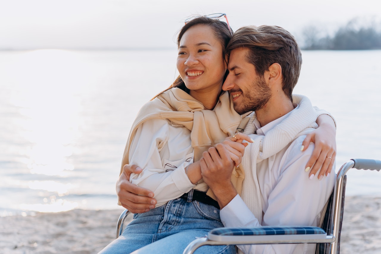 A Romantic Couple Hugging on the Beach
