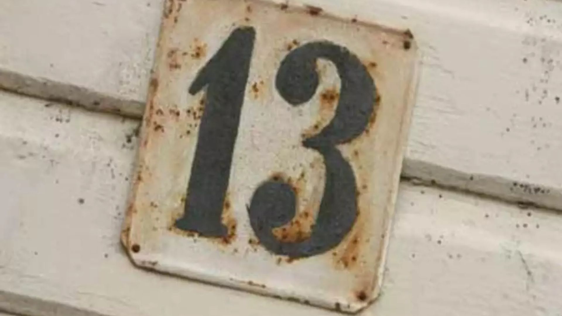 Rusty Number 13 On Metal Plate
