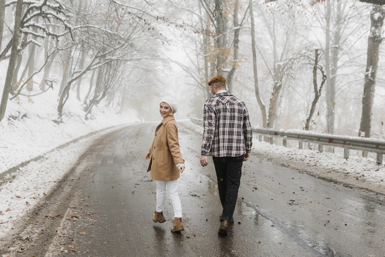 Couple Walking on the Road Together