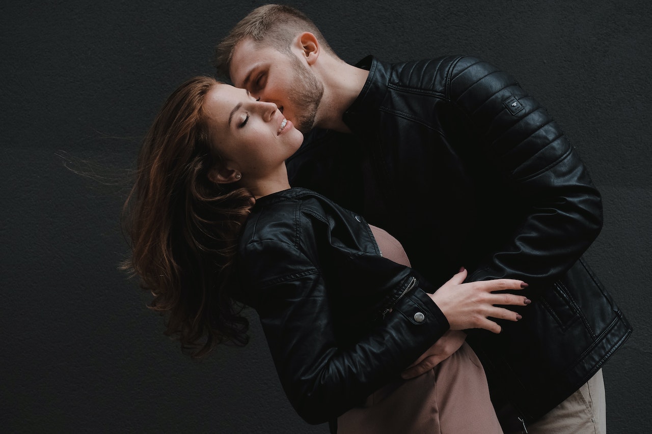 Man Kissing Woman