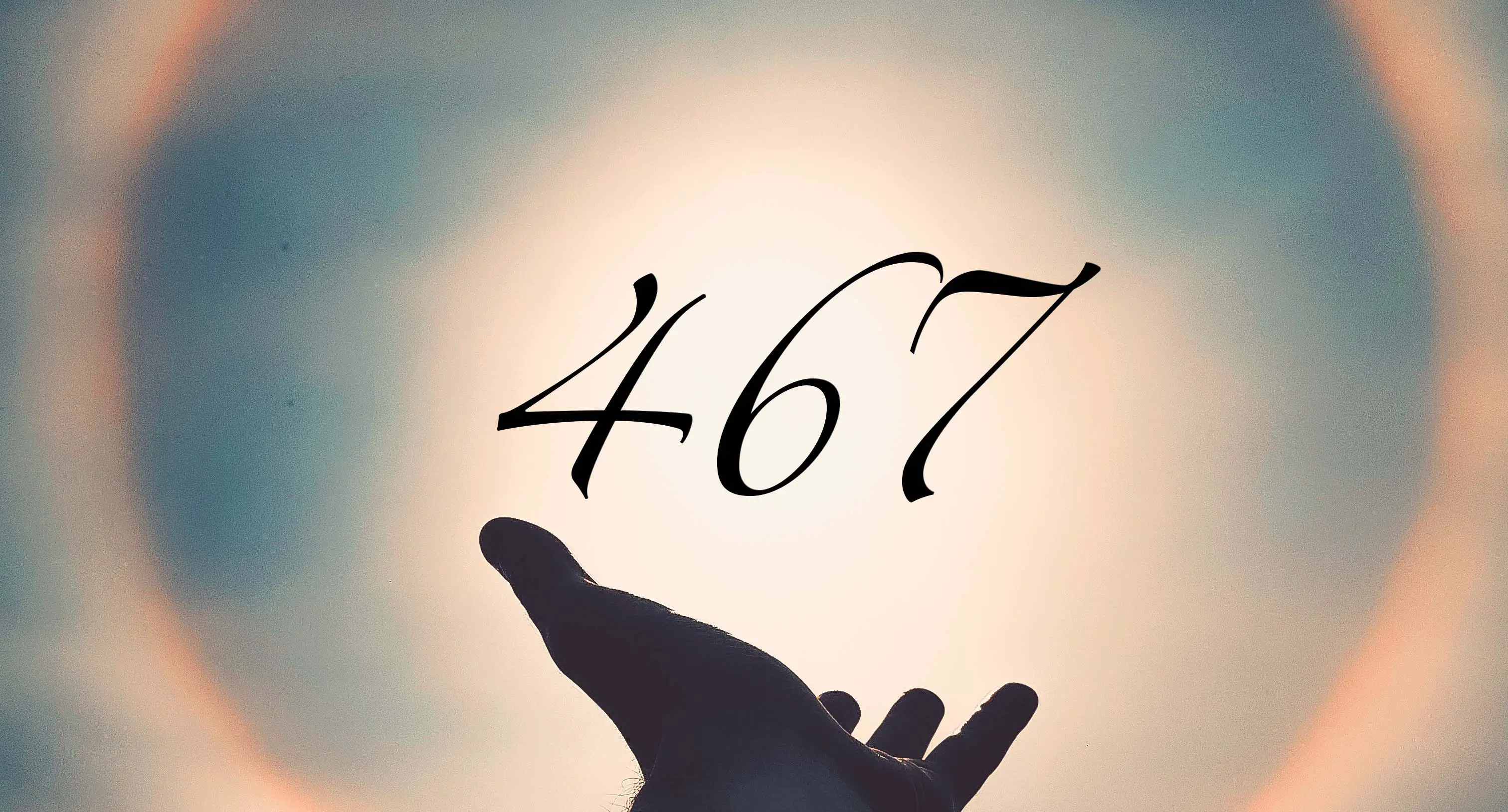 Number 467 floating from an open hand.