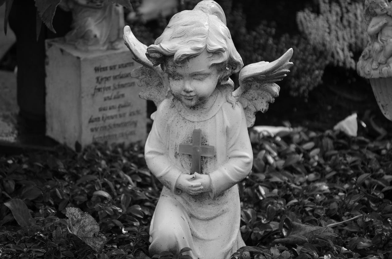 Angel Holding Cross